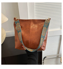 Bootara Women's Convertible Crossbody Bucket — Monochrome PU Carryall with Artisan-Embroidered Strap