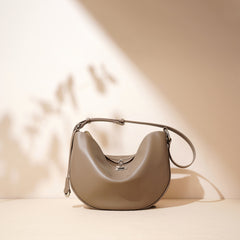 Bootara Women's Hush Rider Bucket — Genuine Leather Saddle Bag with Signature Lock Fastening & Convertible Shoulder Strap