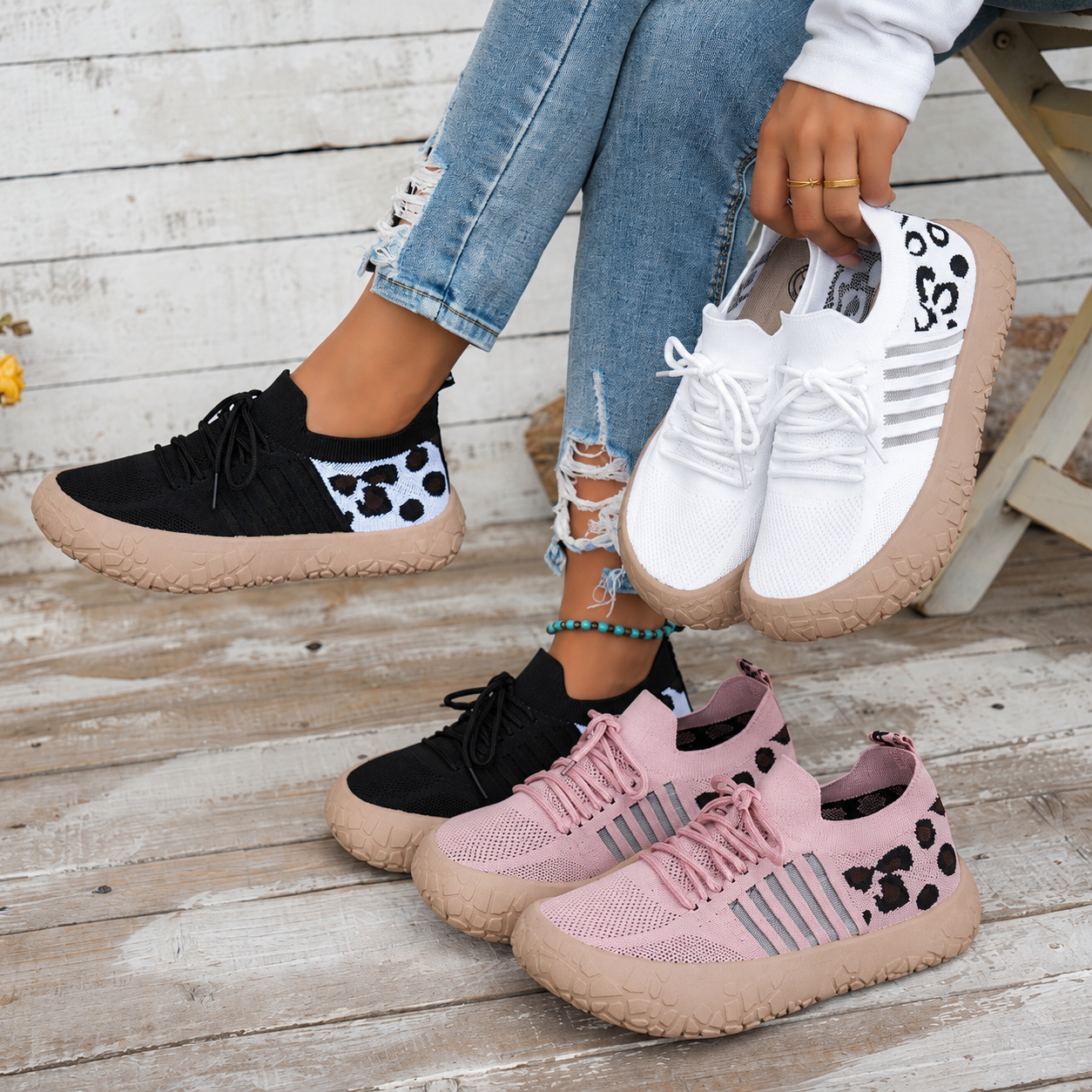 Bootara Cerynna Pink Black White sneakers together with Black worn on feet