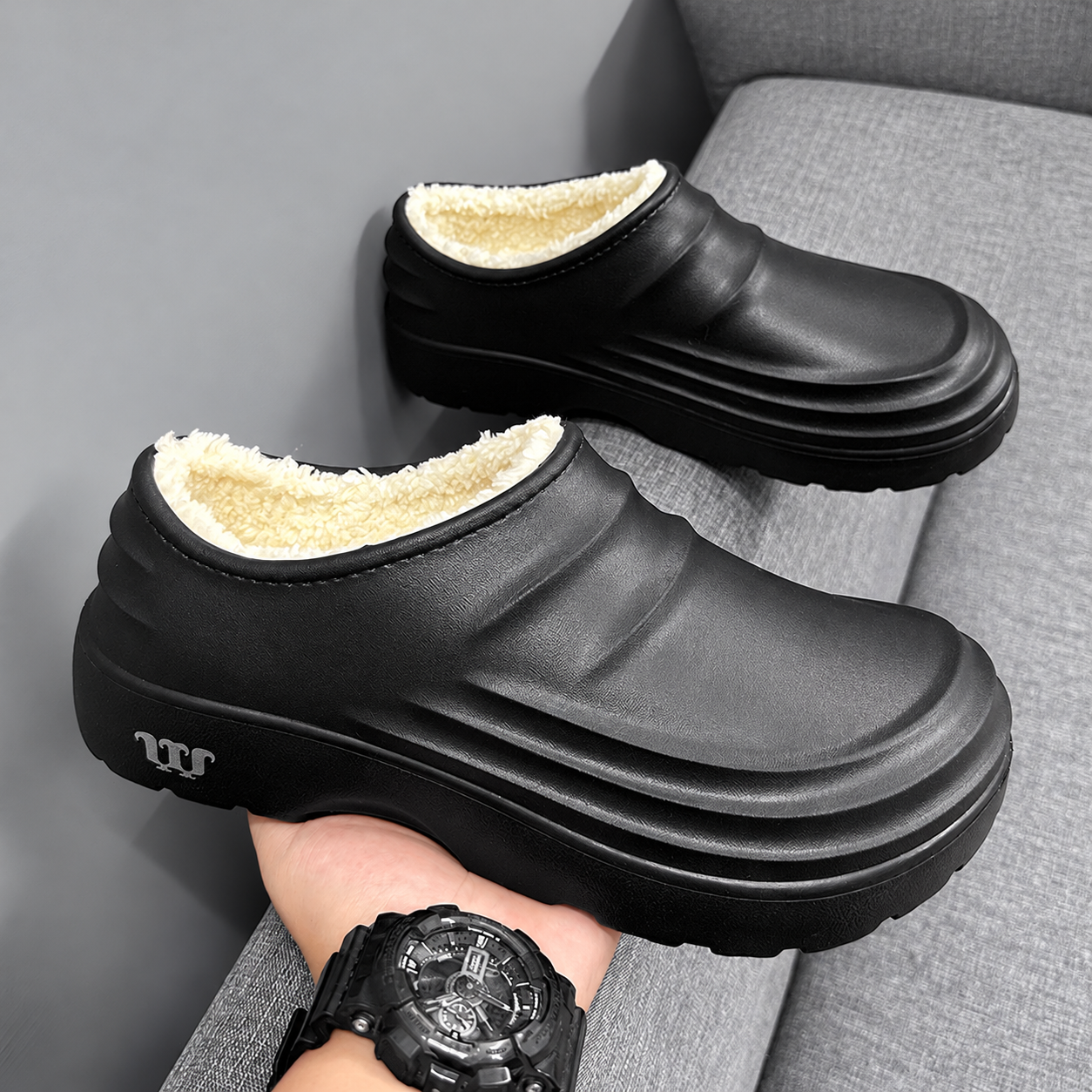 Rovelle Black plush lined slip-on clogs, pair showing sculpted EVA shape and plush interior