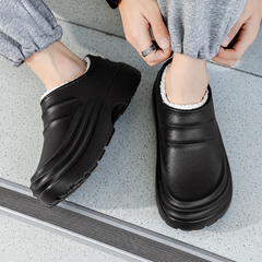 Rovelle Black plush lined slip-on clogs worn on foot, view 4