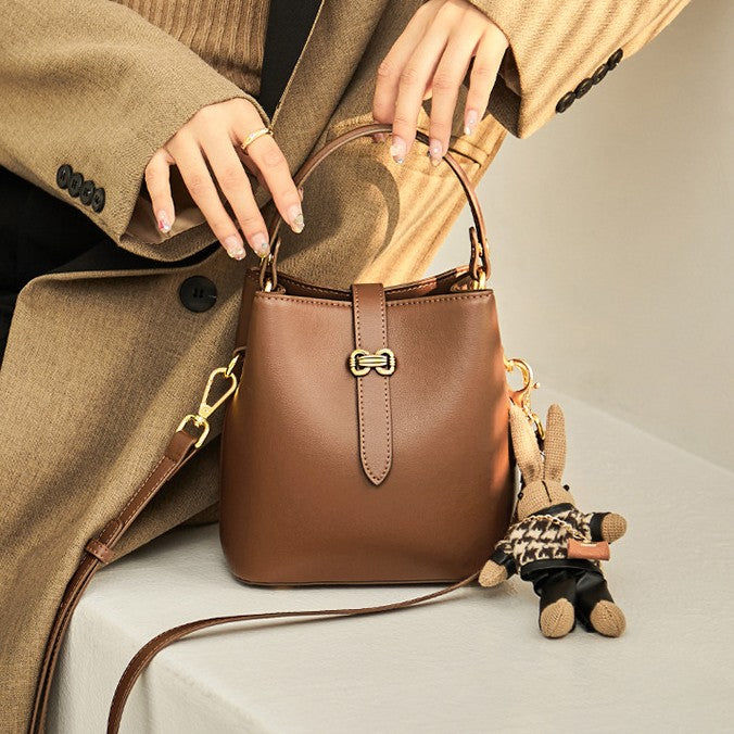 Bootara Women’s Bunny Charm Bucket Satchel — Cowhide Leather Convertible with Sculptural Clasp & Signature Whimsy