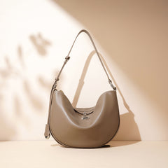 Bootara Women's Hush Rider Bucket — Genuine Leather Saddle Bag with Signature Lock Fastening & Convertible Shoulder Strap