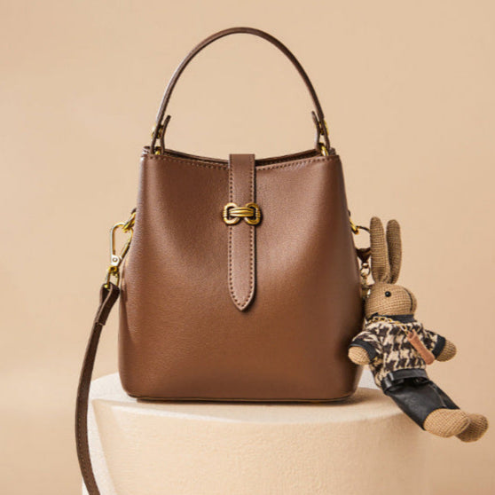 Bootara Women’s Bunny Charm Bucket Satchel — Cowhide Leather Convertible with Sculptural Clasp & Signature Whimsy