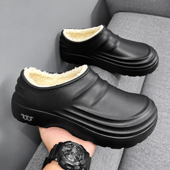 Rovelle Black plush lined slip-on clogs, pair showing sculpted EVA shape and plush interior