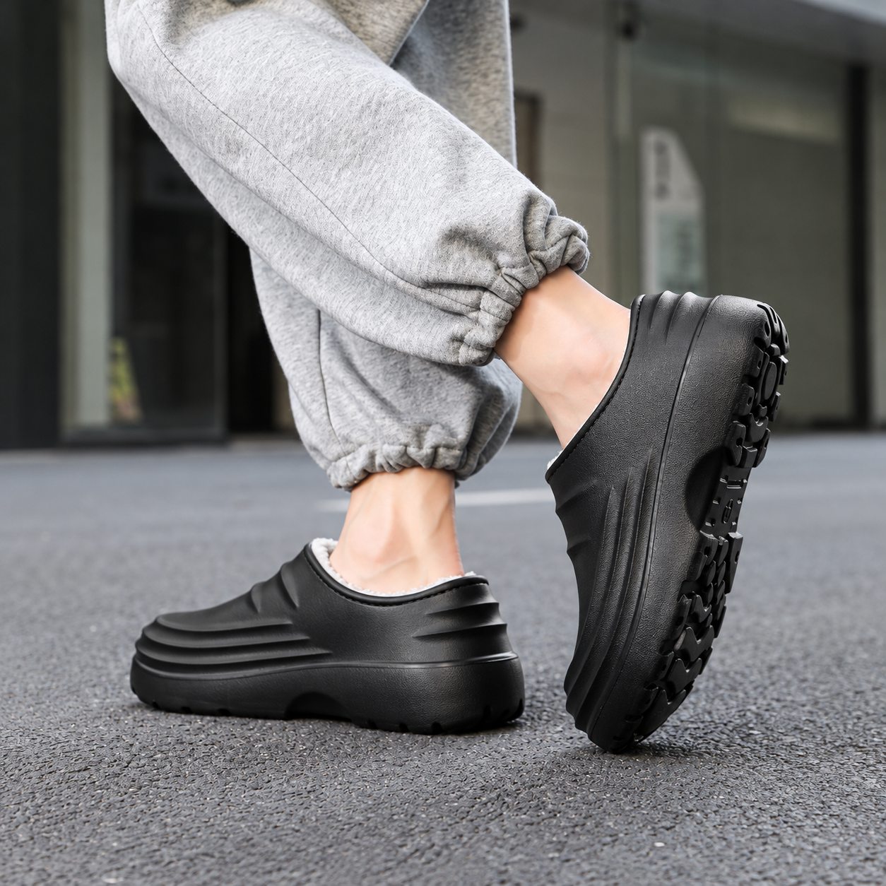 Rovelle Black plush lined slip-on clogs worn on foot, view 3