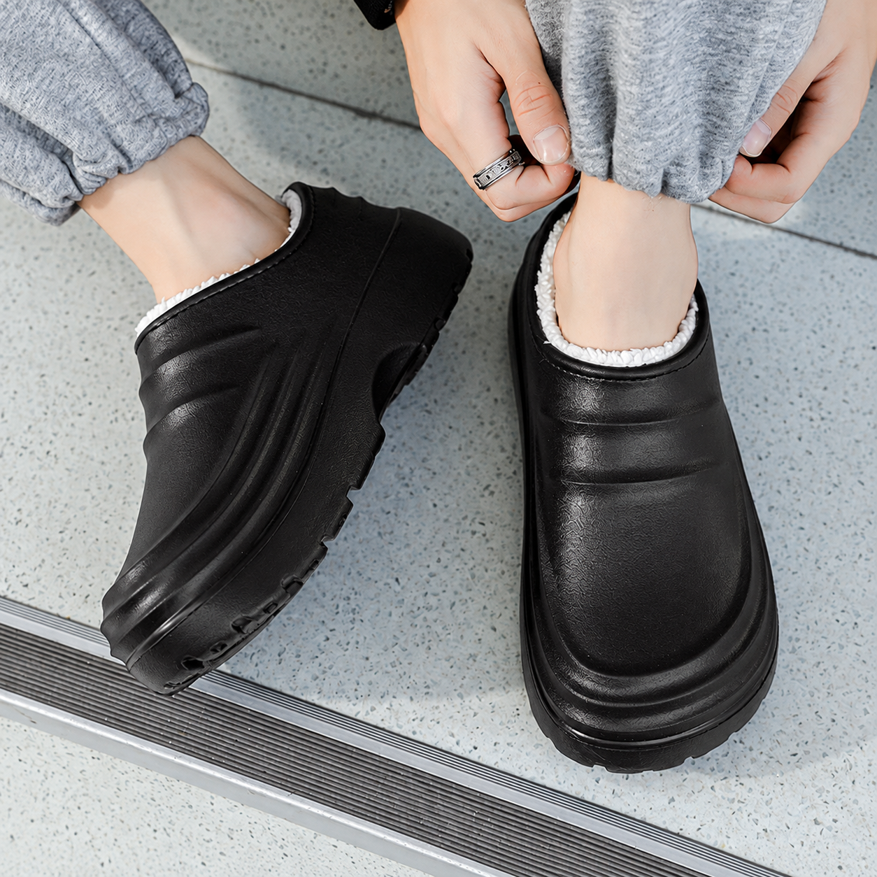 Rovelle Black plush lined slip-on clogs worn on foot, view 4