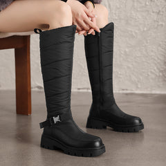 Nivrelle Black quilted knee-high winter boots with ankle buckle and lug sole