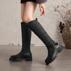 Nivrelle Black quilted knee-high winter boots with ankle buckle and lug sole