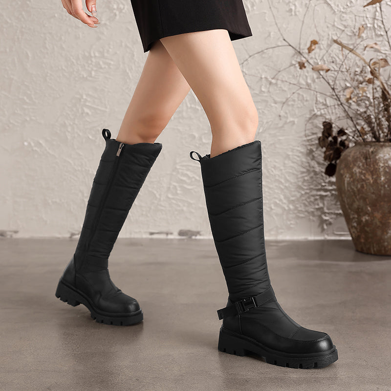 Nivrelle Black quilted knee-high winter boots with ankle buckle and lug sole