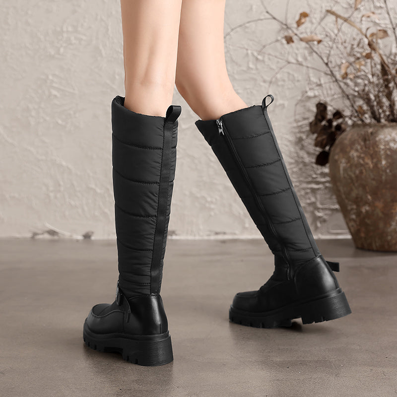 Nivrelle Black quilted knee-high winter boots with ankle buckle and lug sole