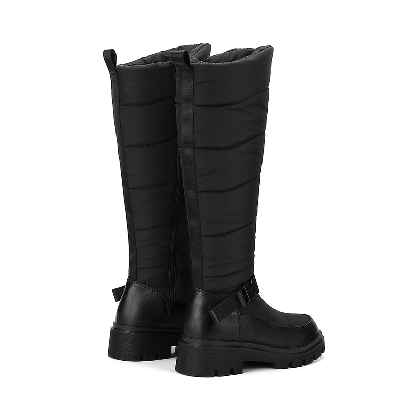Nivrelle Black quilted knee-high winter boots with ankle buckle and lug sole