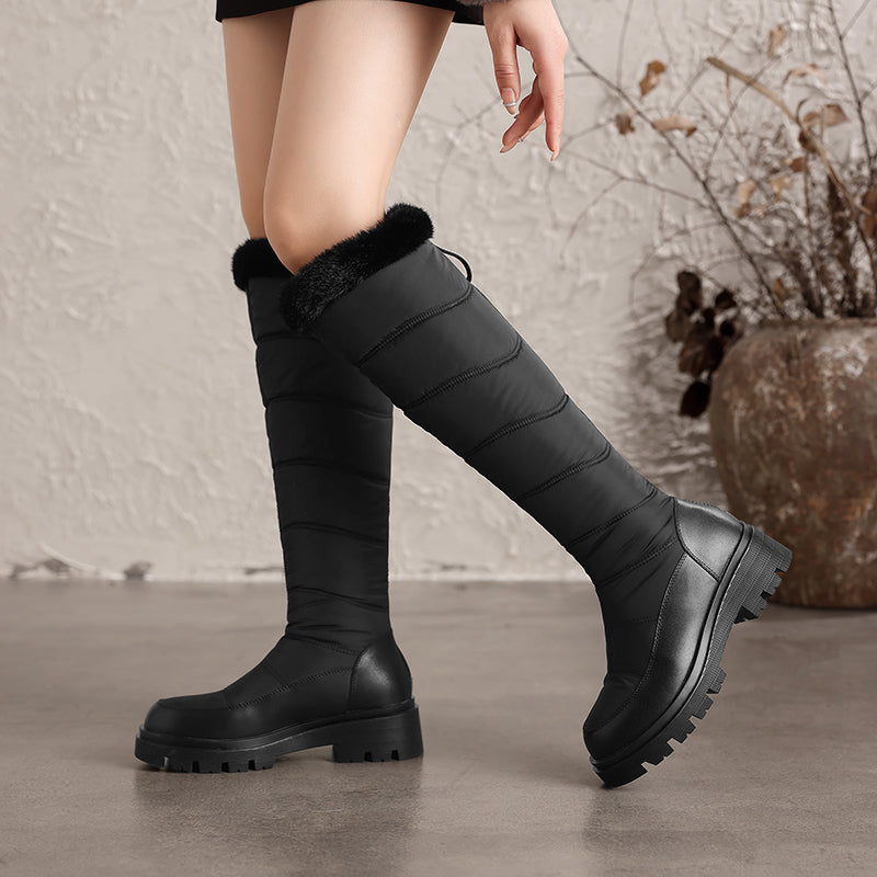 Thalvyn Black quilted knee-high winter boots with plush cuff and chunky lug sole