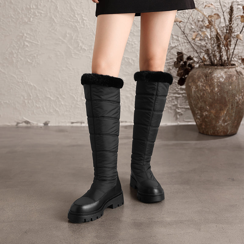 Thalvyn Black quilted knee-high winter boots with plush cuff and chunky lug sole