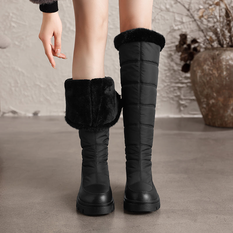 Thalvyn Black tall quilted winter boots with folded plush cuff and lining shown