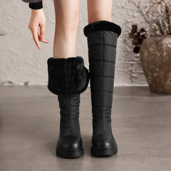 Thalvyn Black tall quilted winter boots with folded plush cuff and lining shown